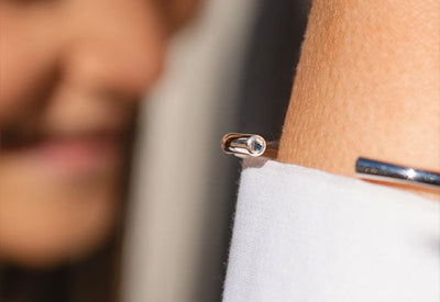 Sterling silver bangle with facetted Labradorite gemstone in each end