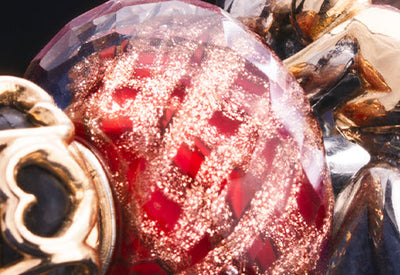 close up of Smiles & Gifts red glass Bead