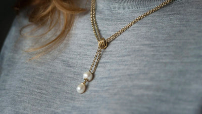 gold fantasy necklace with white pearl and white pearl bead